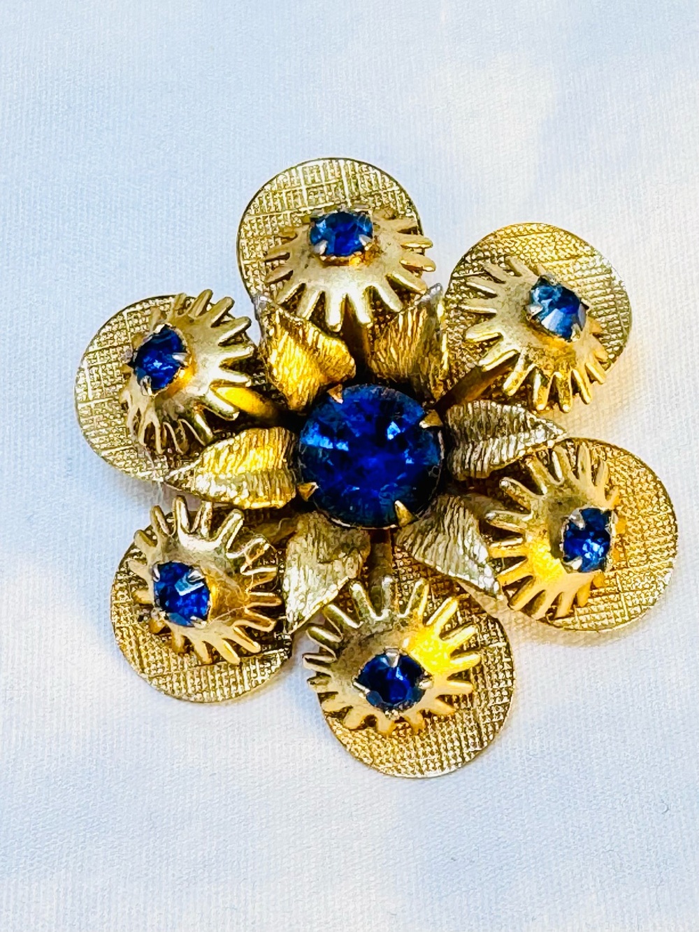 Gold-Tone Flower Brooch with Royal Blue Crystals
